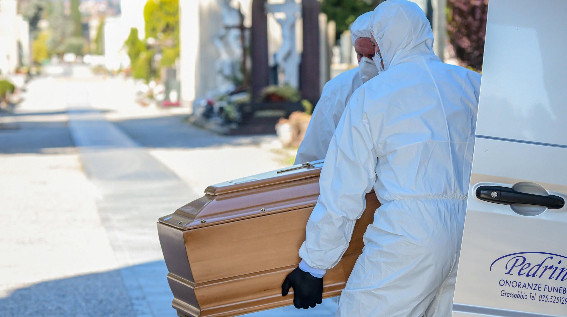 Undertakers carrying a coffin in Bergamo, Lombardy on March 16, 2020.