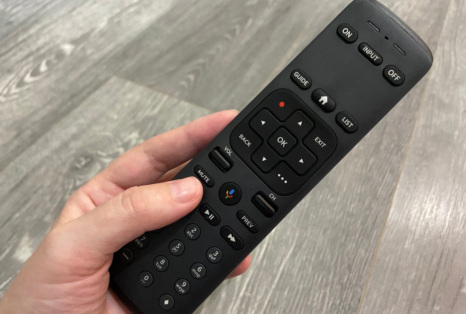 AT&T TV’s remote with a button for the Google Assistant.