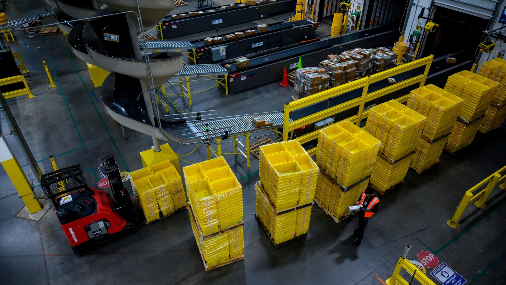 A man works at a distribution station at the 855,000 square-foot Amazon fulfillment center in Staten Island, one of the five boroughs of New York City, on February 5, 2019