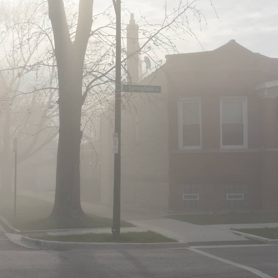 Dust settles in Little Village after the coal plant implosion on Saturday.