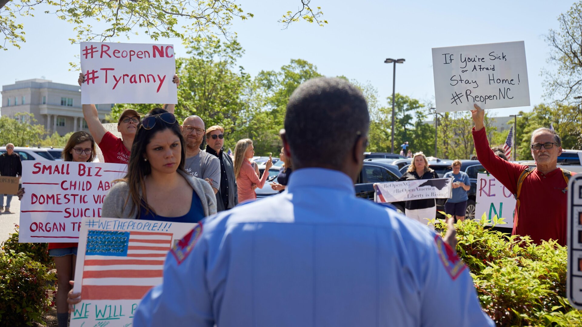 A Raleigh, North Carolina police officer in an argument with protesters on April 14.
