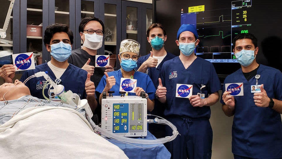 Doctors at the Icahn School of Medicine at Mount Sinai in New York City give a thumbs up after testing a ventilator prototype developed by NASA.