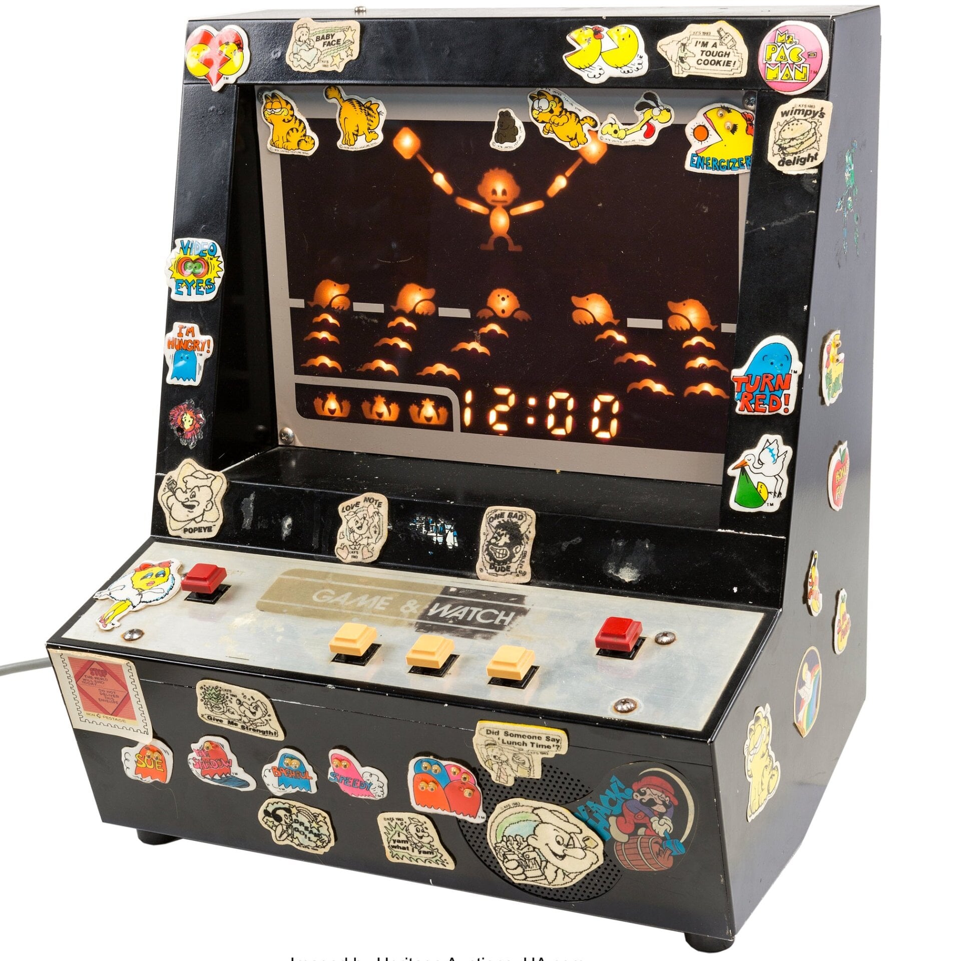 The added stickers are vintage too, and Heritage Auctions has decided to leave them on the machine.