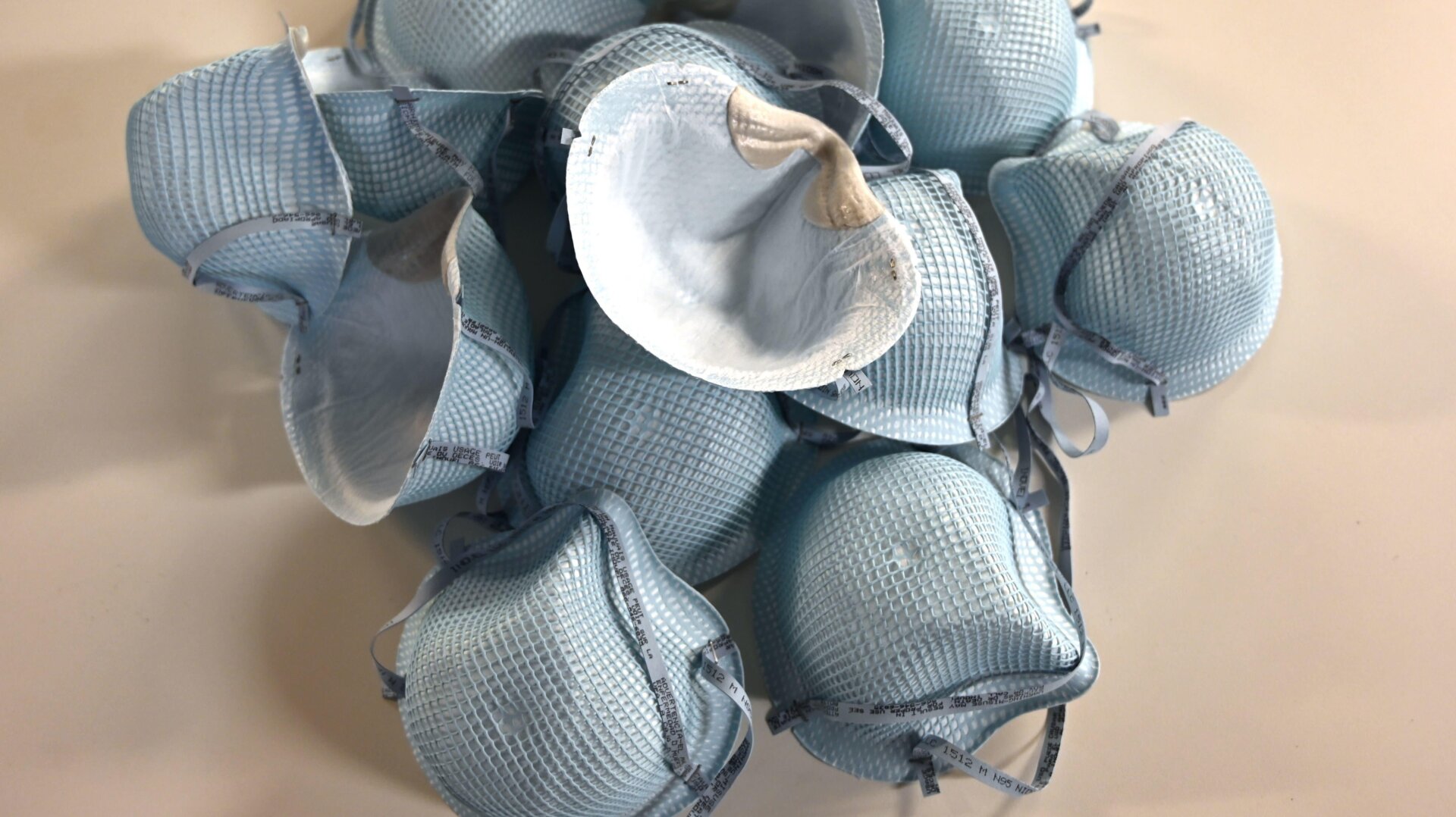 In this illustration dated February 26, 2020, protective N-95 face masks lie on a table at an office in Washington, DC.