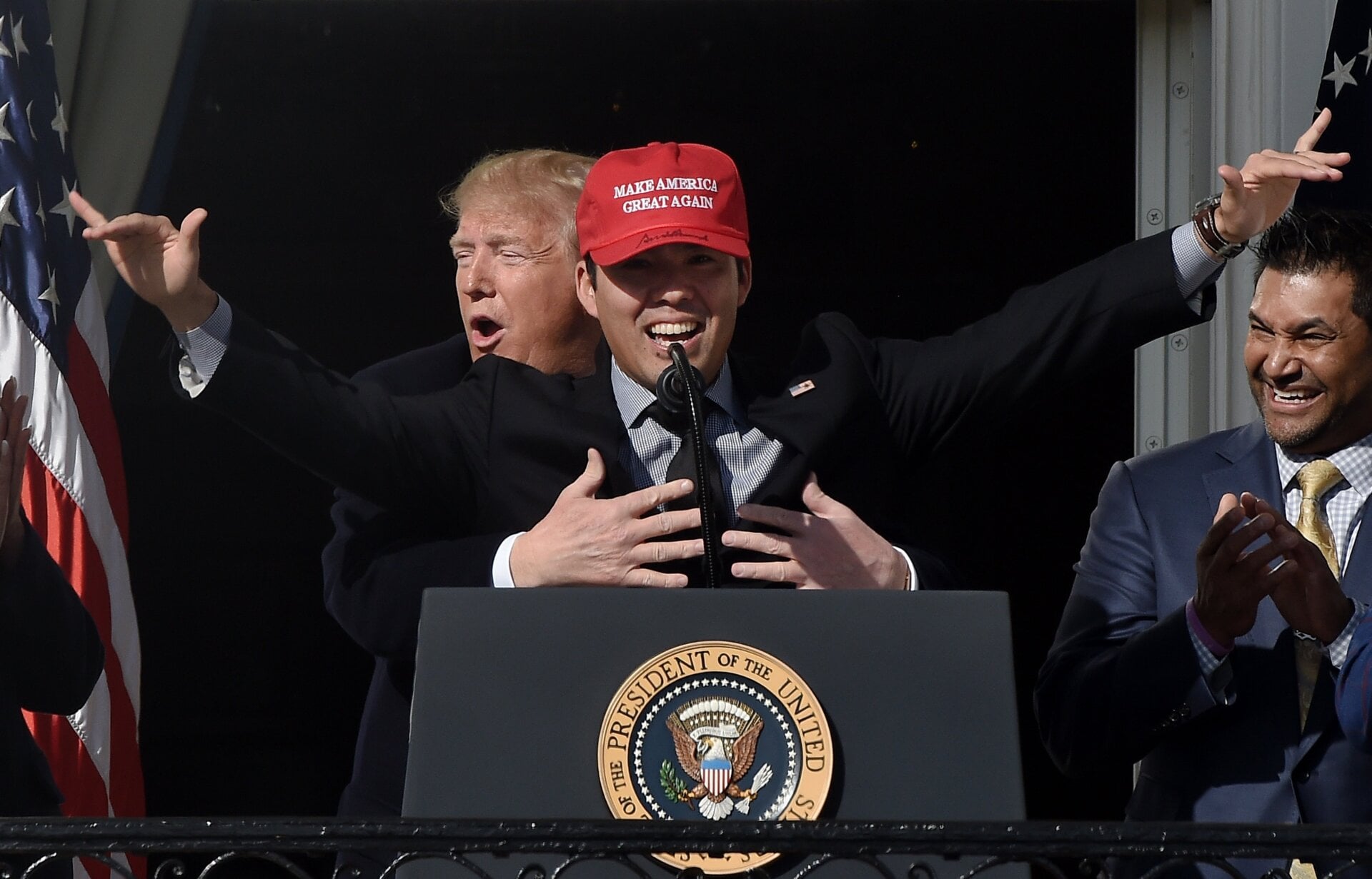 President Donald Trump fondles baseball player Kurt Suzuki at the White House on November 4, 2019. Not from the White House Flickr account.