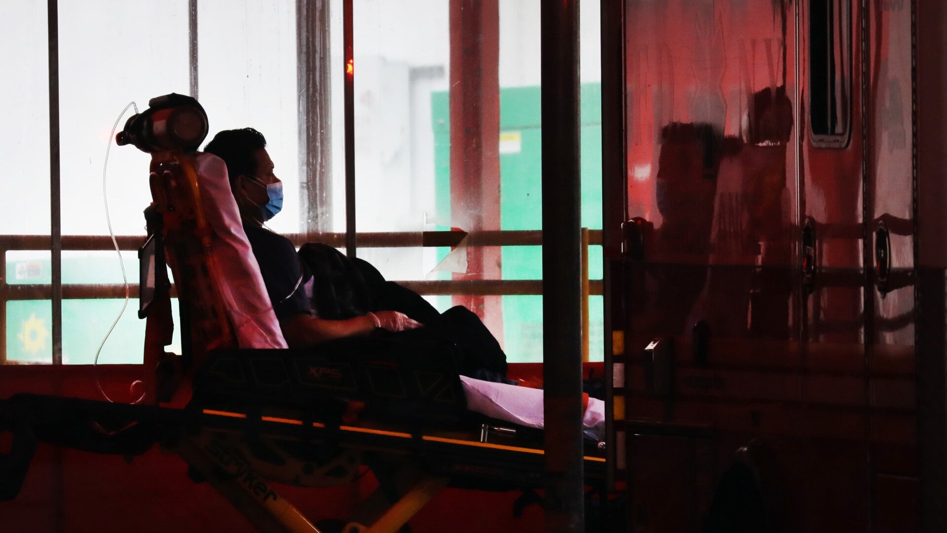 A man is brought into Elmhurst Hospital in the Queens neighborhood, which has one of the highest infection rates of coronavirus in the nation, earlier this week in New York City.