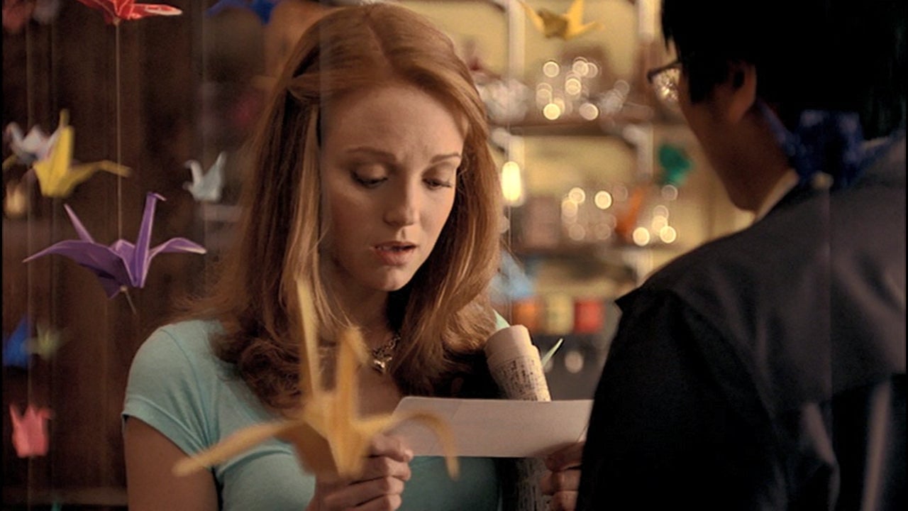 Charlie reading a note from Hiro.