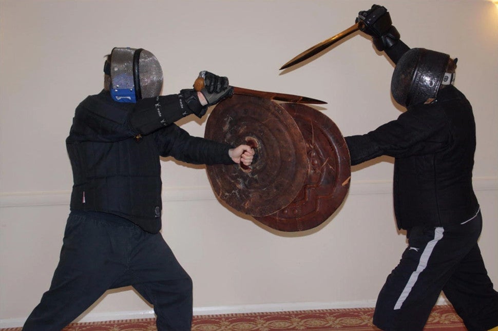 Study participants engaging in realistic sword fighting.