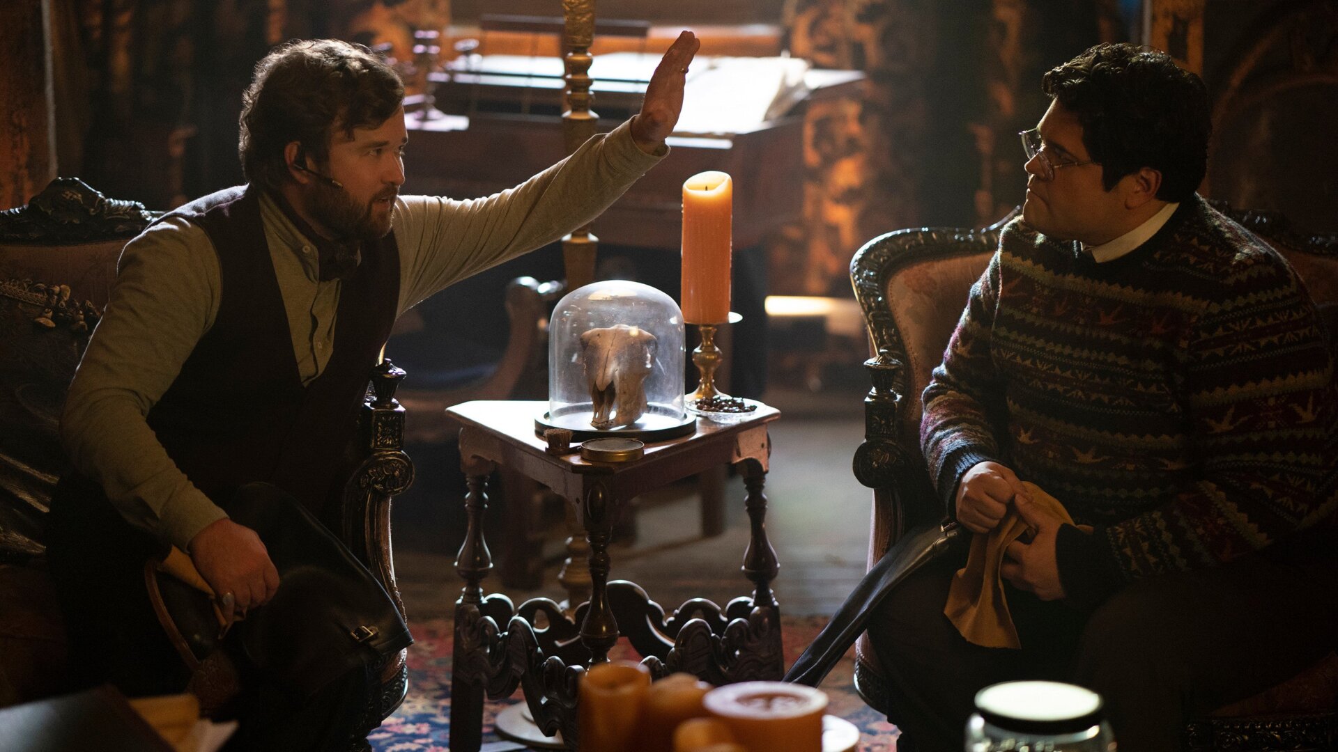 Topher (Haley Joel Osment) simply insists on a high-five from fellow familiar Guillermo (Harvey Guillén).