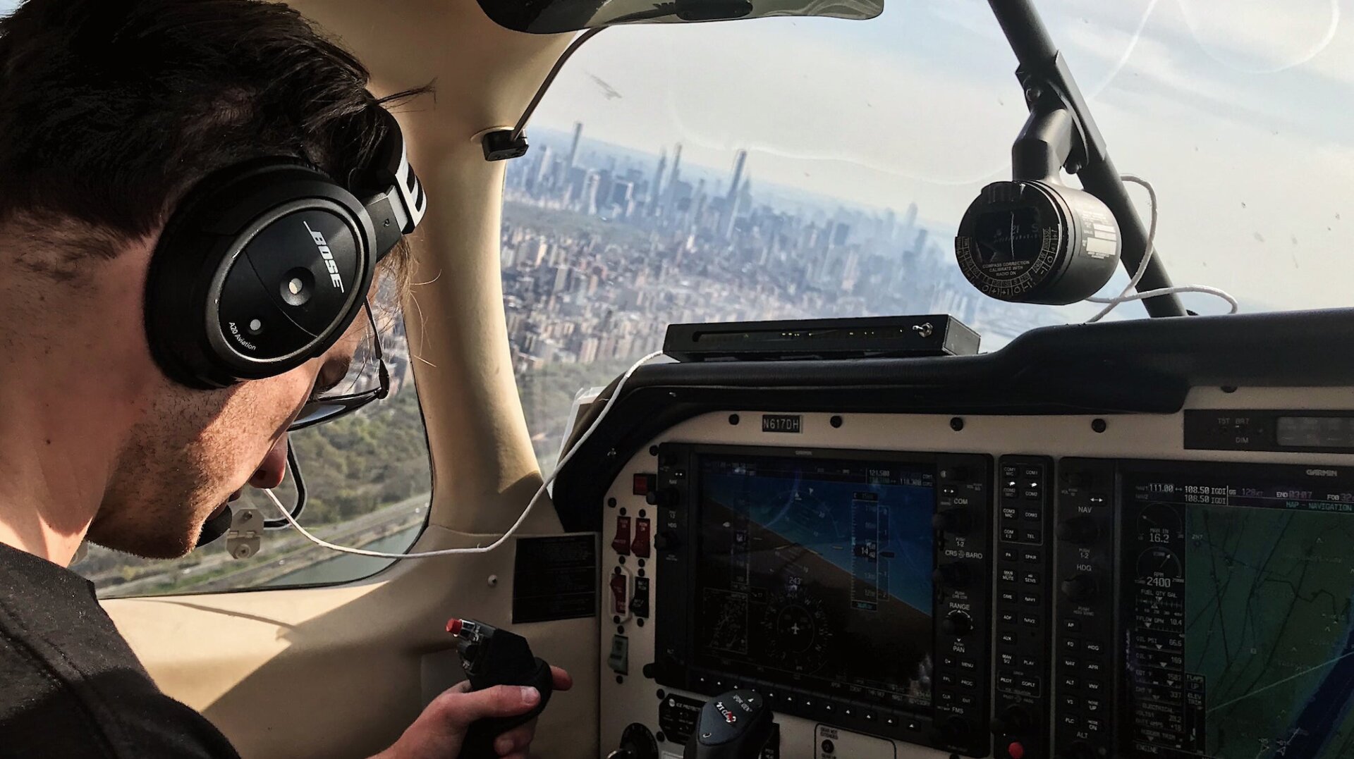 Paolo Wilczak, a pilot with Scientific Aviation, collects air samples for NOAA as he approaches Manhattan from the north on April 25, 2020.