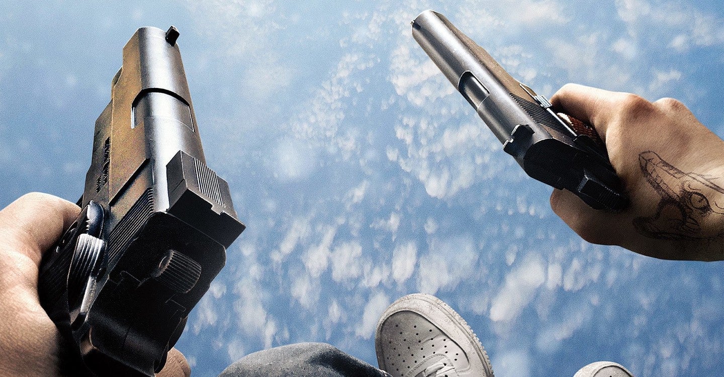 Wait, is this dude jumping out of a plane with guns? Yes. Yes he is.