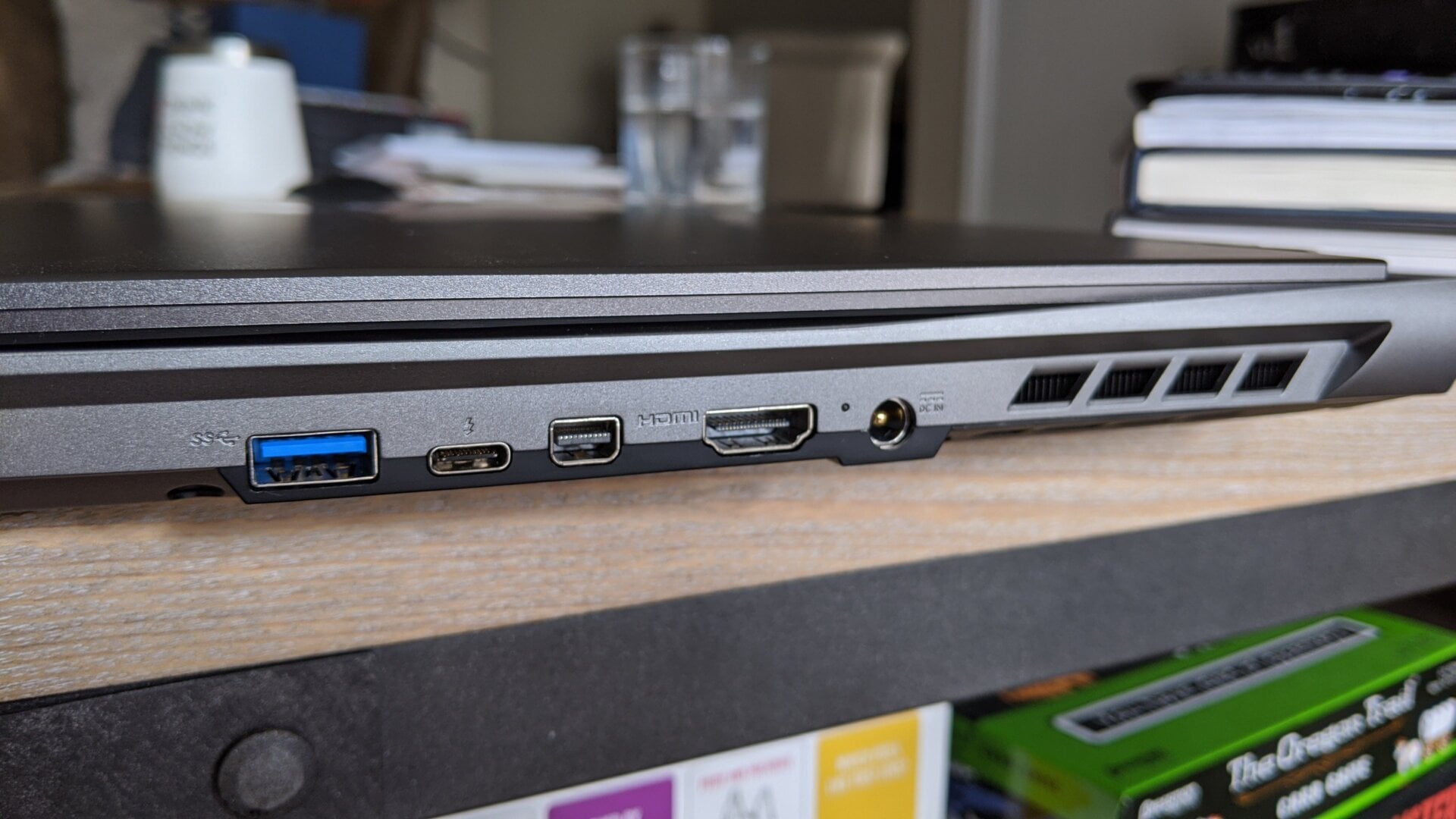 Power adapter port, to the right of the HDMI port.