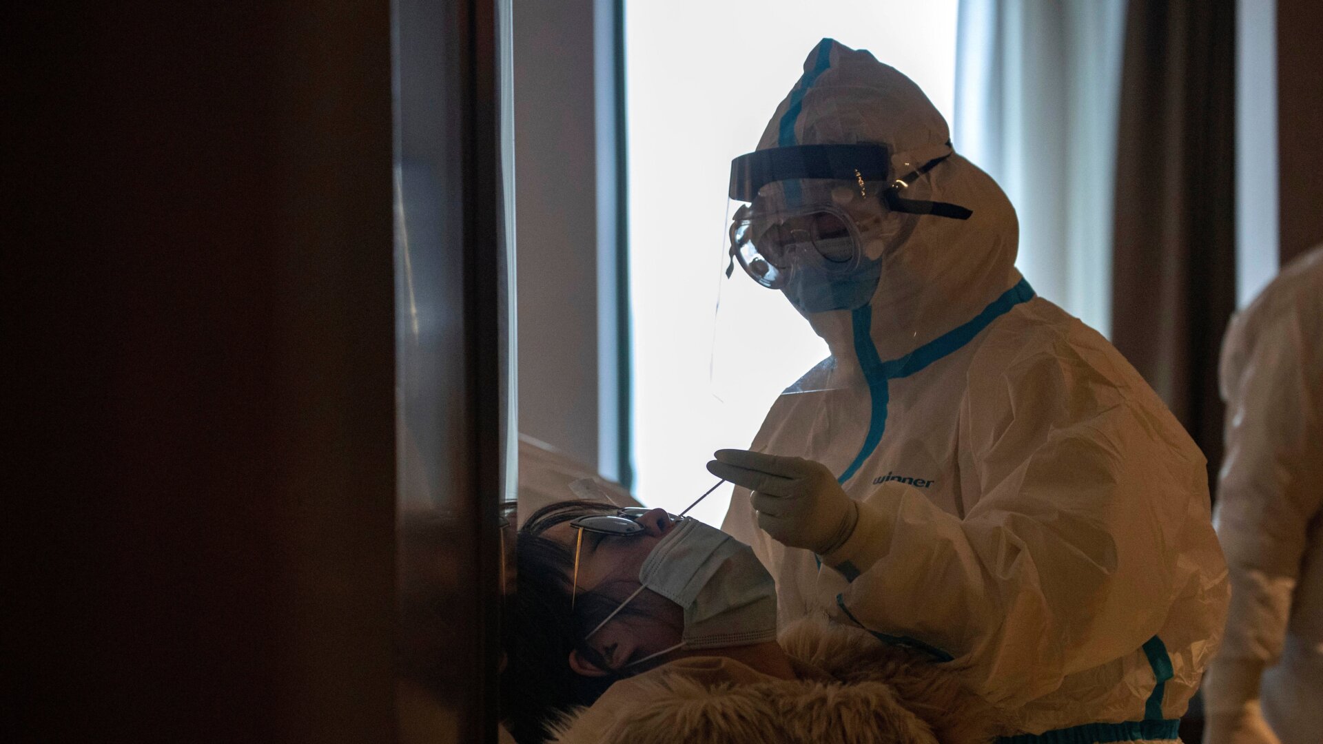 Image: Woman receives covid-19 test in Wuhan on March 31st, 2020