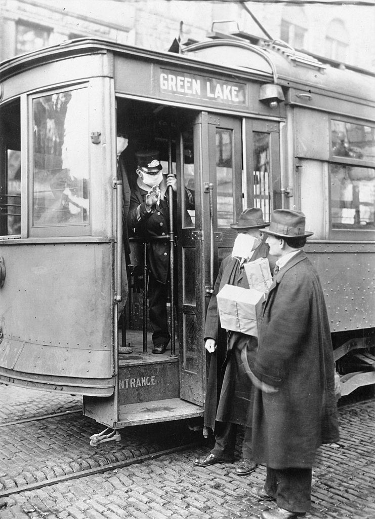 Precautions taken in Seattle, Washington during the “Spanish Influenza” pandemic would not permit anyone to ride on the street cars without wearing a mask. 1918.