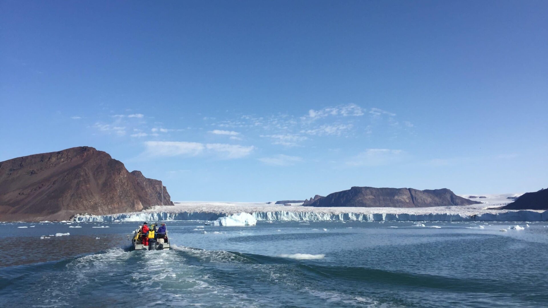 Researchers and Inuit hunters approach Bowdoin Glacier in northwest Greenland. 