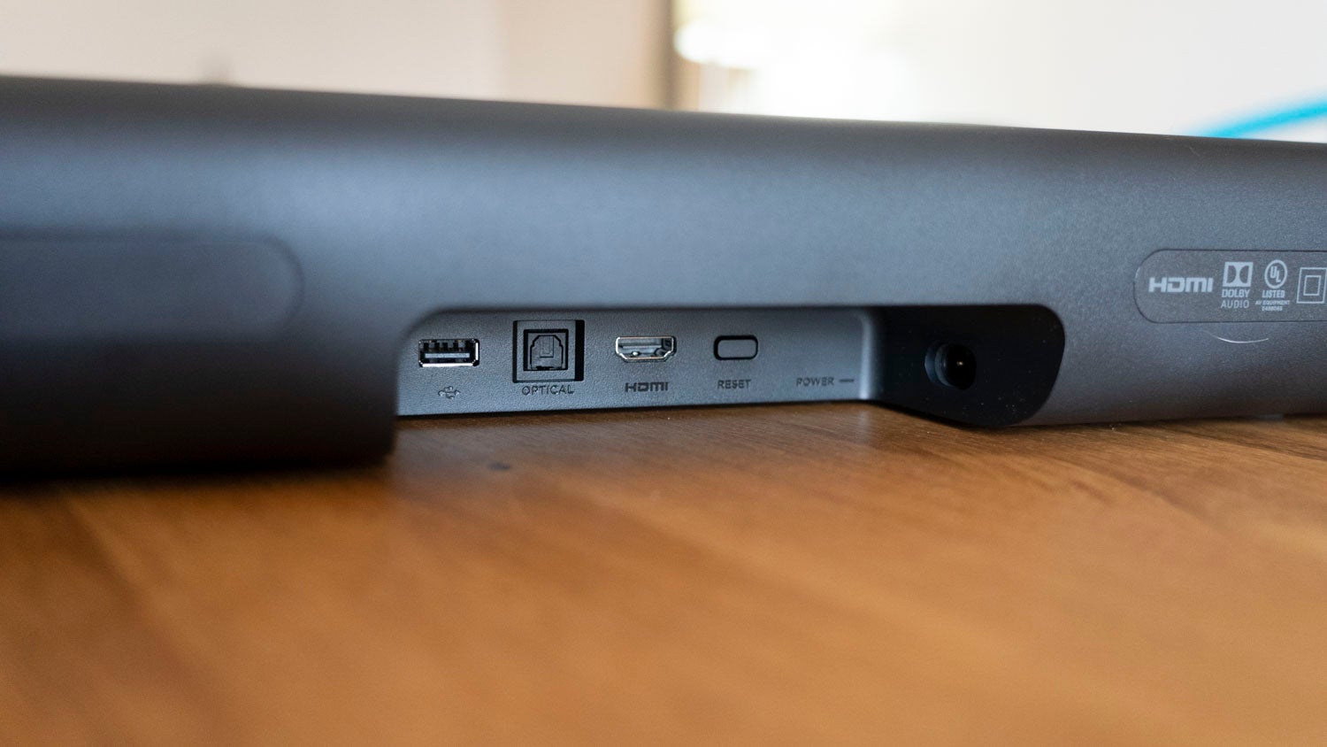 The sound bar, which we’ve reviewed previously, has a built in set top box and both HDMI and digital optical out.