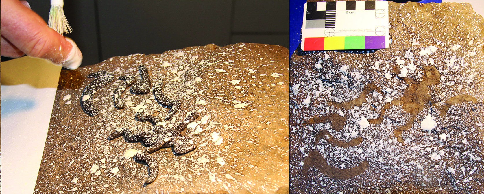 Researchers replicating the technique used to create the stenciled drawings. 