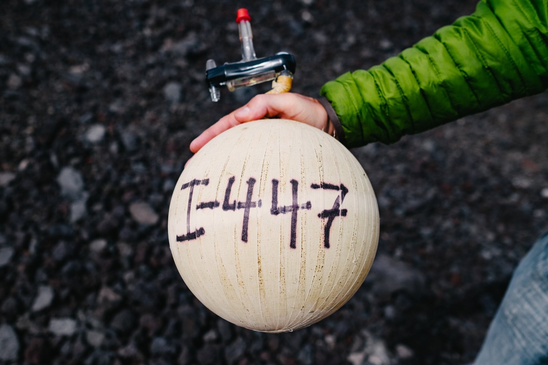 A glass globe holding that day’s Keeling Curve measurement.