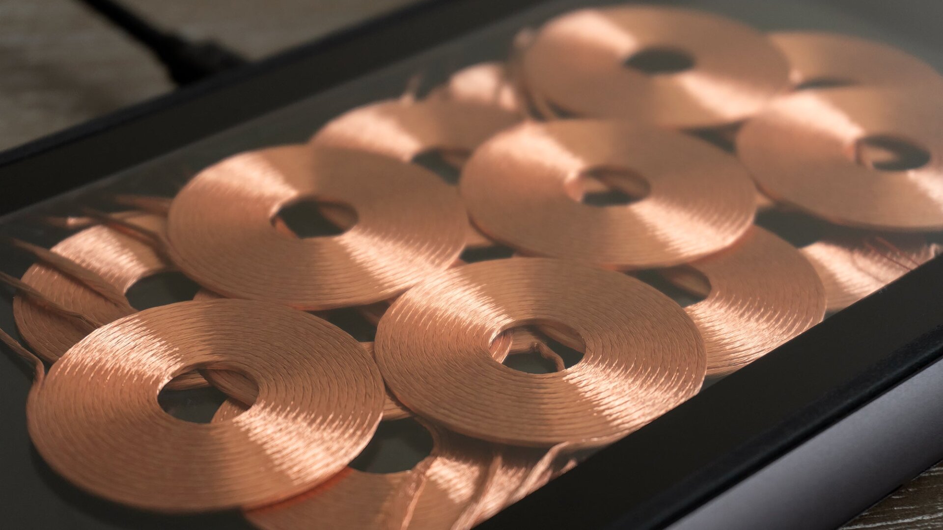 The 16 overlapping coils inside the Zens Liberty charger are a work of art, and the see-through Glass Edition is the version we recommend.