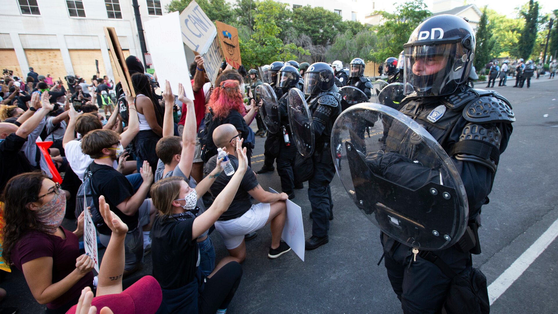 Officers form a riot wall near the White House on June 1, 2020.