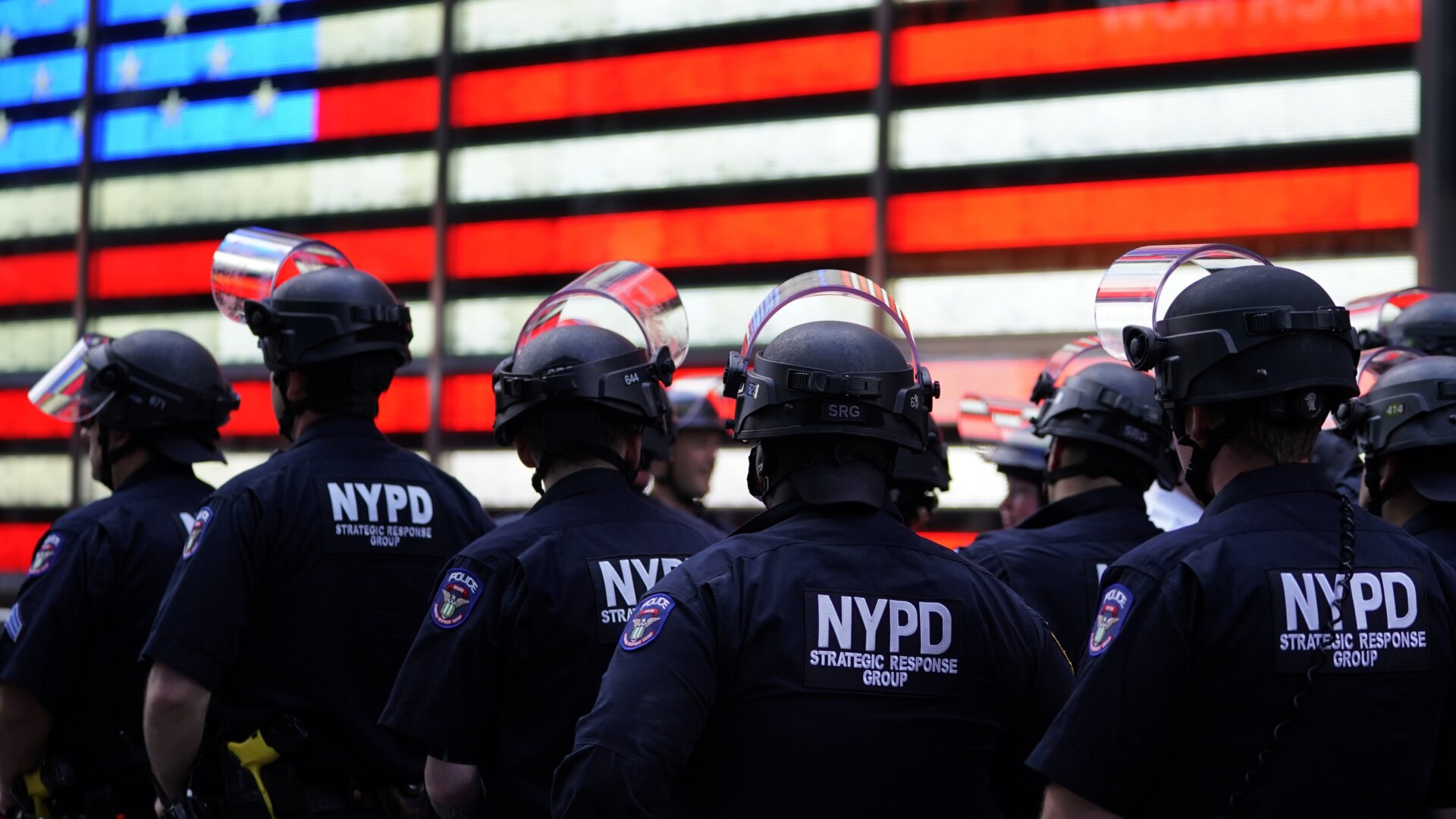 NYPD police officers watch demonstrators in Times Square on June 1, 2020, during a “Black Lives Matter” protest.