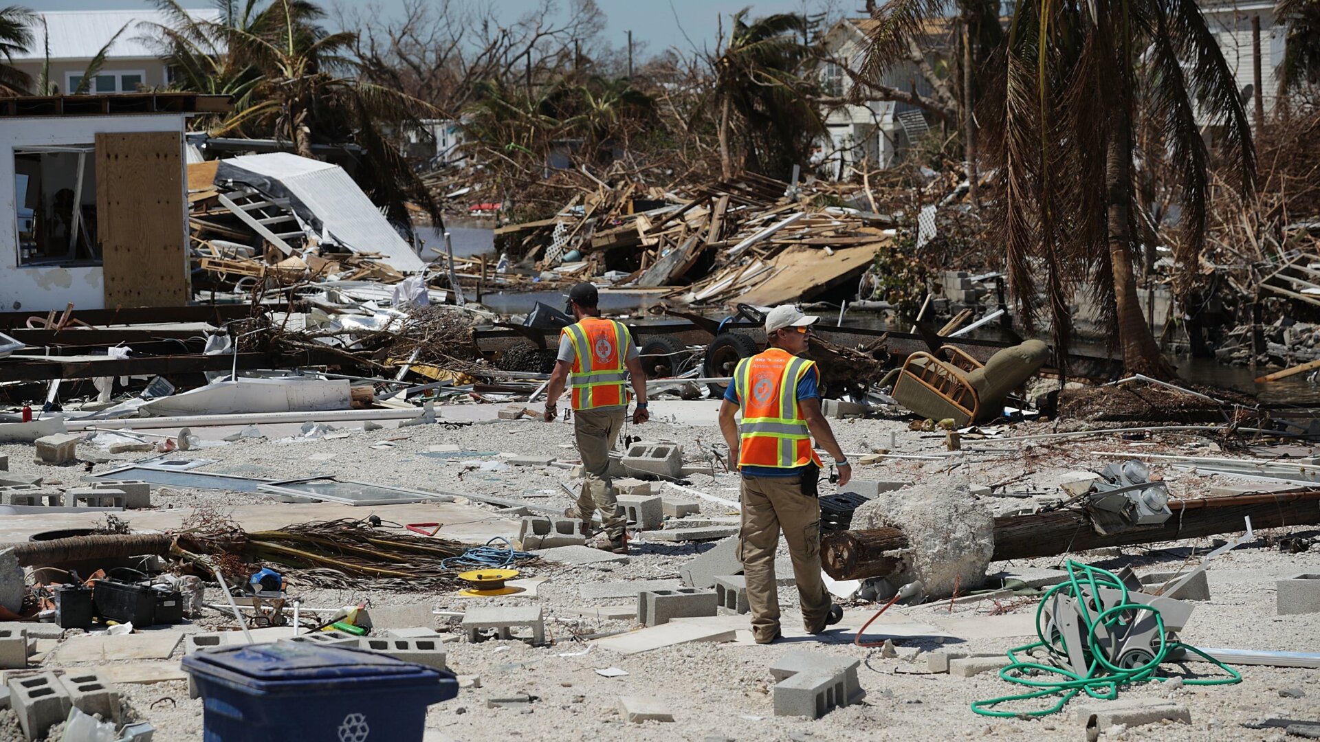 Rescue volunteers search for people in a waterfront neighborhood in Marathon, Florida hit hard by 2017's Hurricane Irma.