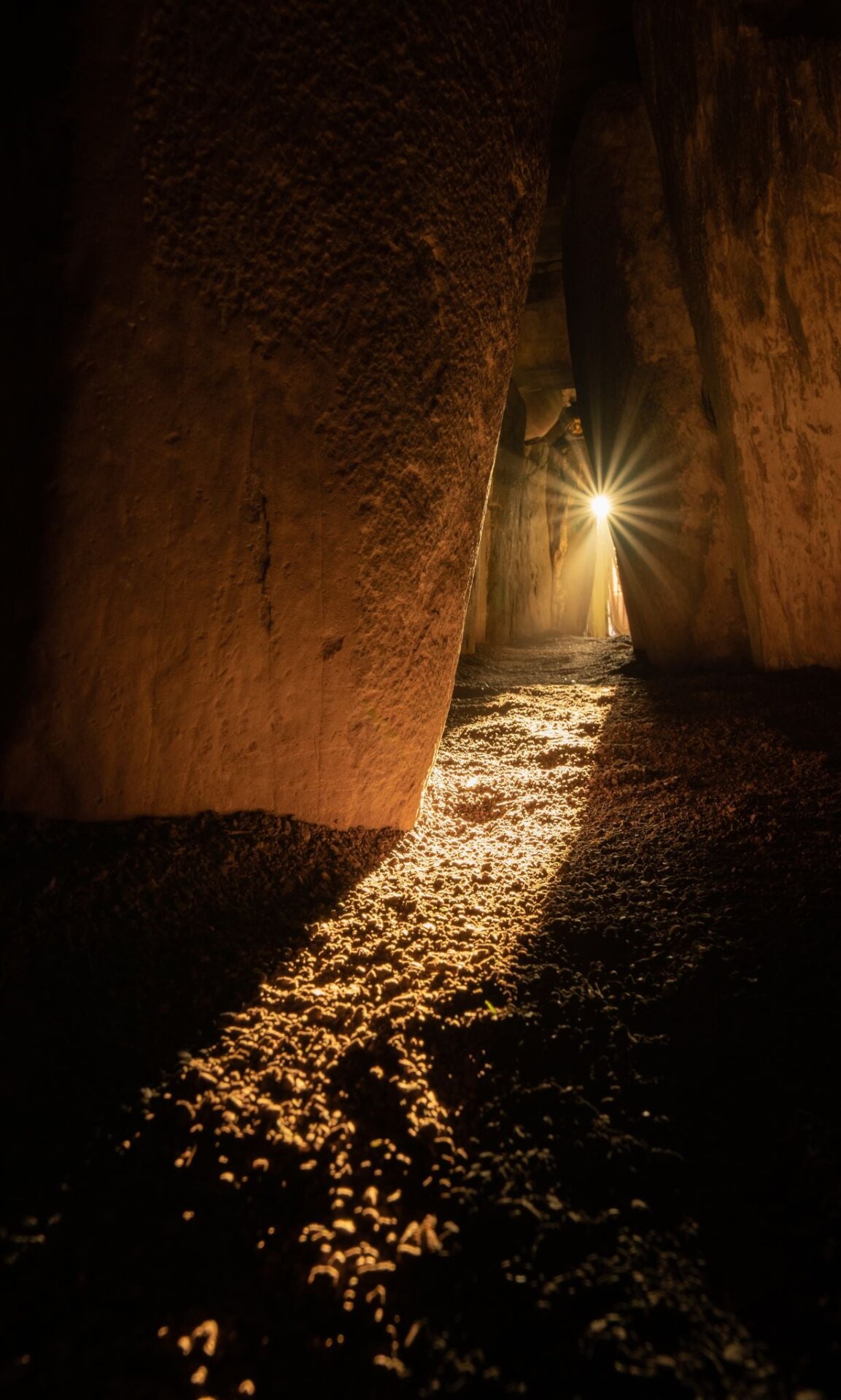 Winter solstice sunlight shining into the sacred chamber of Newgrange passage tomb.