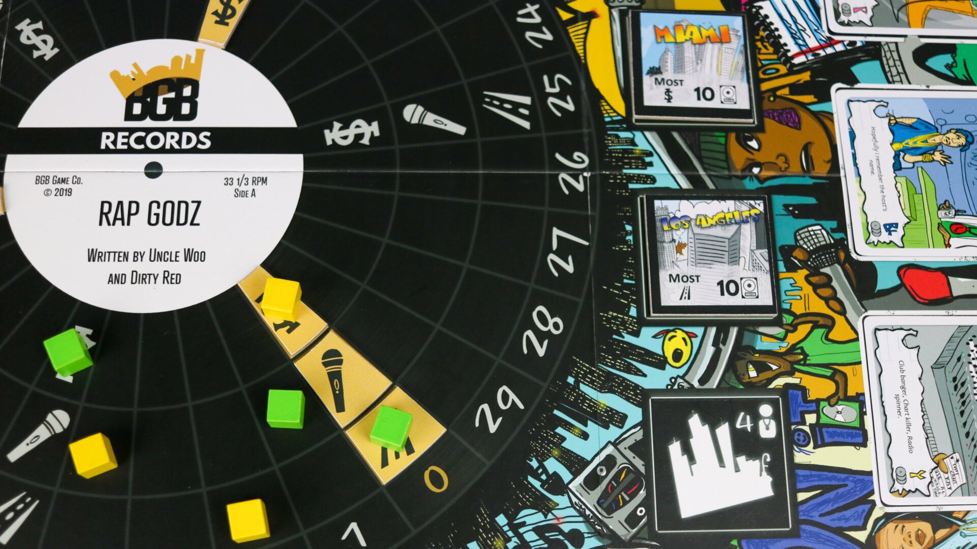 Much of the gameplay revolves around a turntable, which is the focal point of the board.