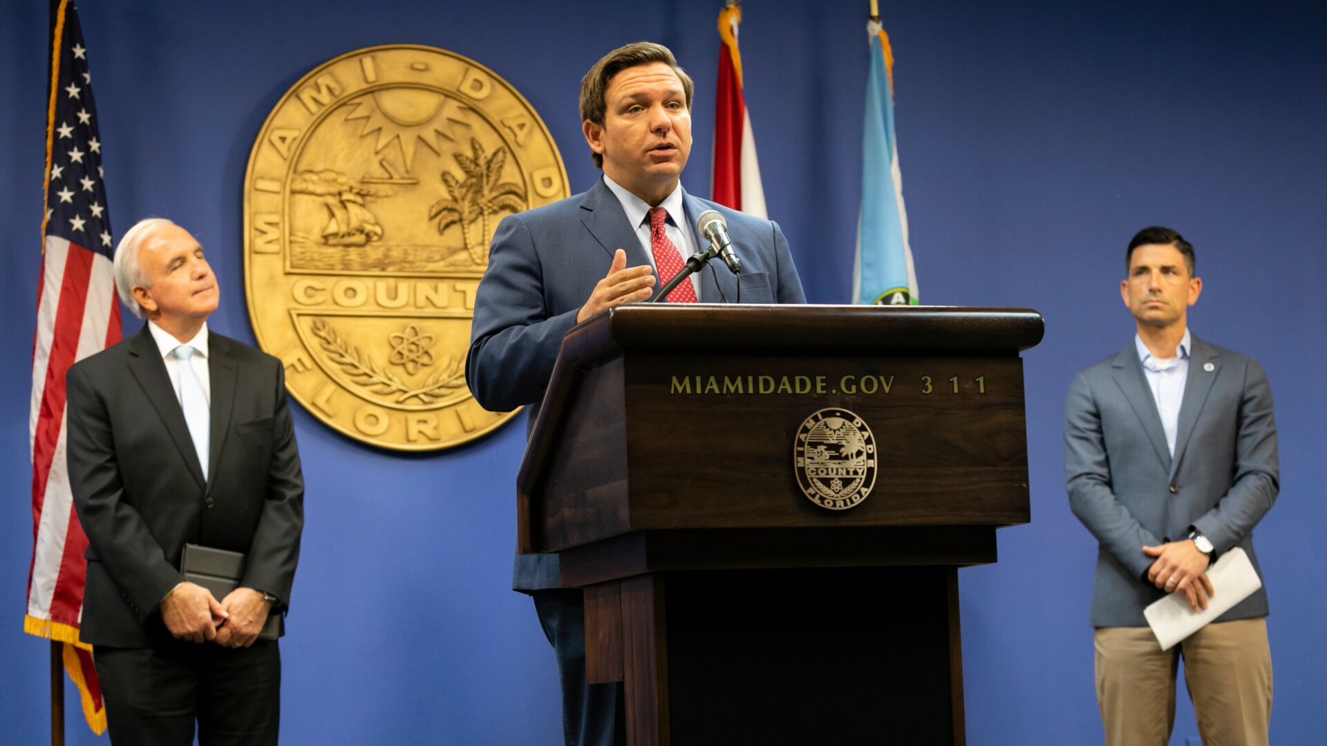 Florida Governor Ron DeSantis (center) speaks during a press conference relating hurricane season updates at the Miami-Dade Emergency Operations Center on June 8, 2020, in Miami, Florida.