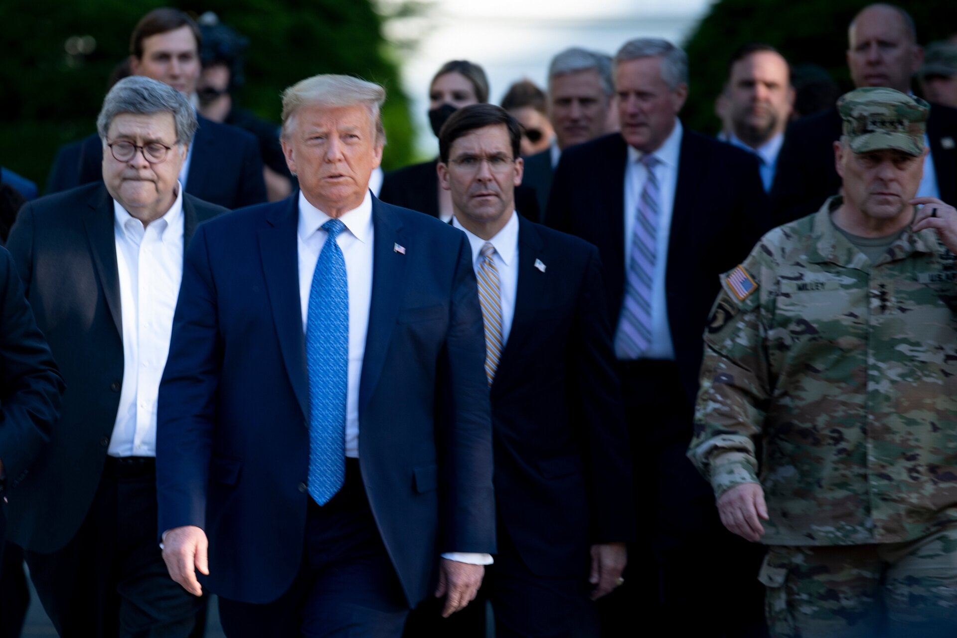 US President Donald Trump walks with US Attorney General William Barr (L), US Secretary of Defense Mark T. Esper (C), Chairman of the Joint Chiefs of Staff Mark A. Milley (R), and others from the White House to visit St. John’s Church after the area was cleared of people protesting the death of George Floyd June 1, 2020, in Washington, DC