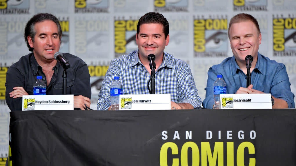The creators of Cobra Kai, conveniently identified by placards on a 2019 Comic-Con panel.