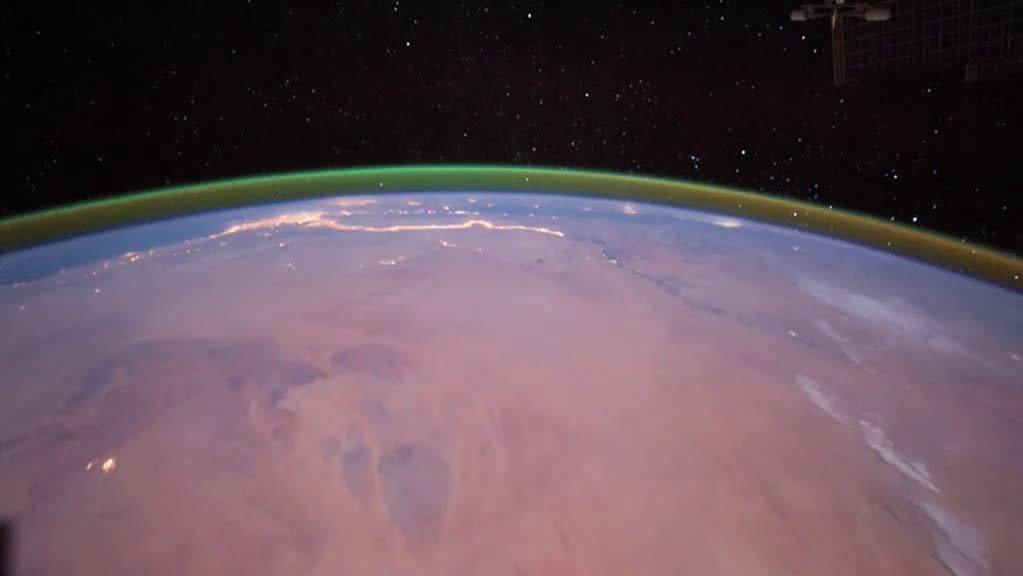 Green airglow in Earth’s atmosphere, as seen from the ISS in 2011.