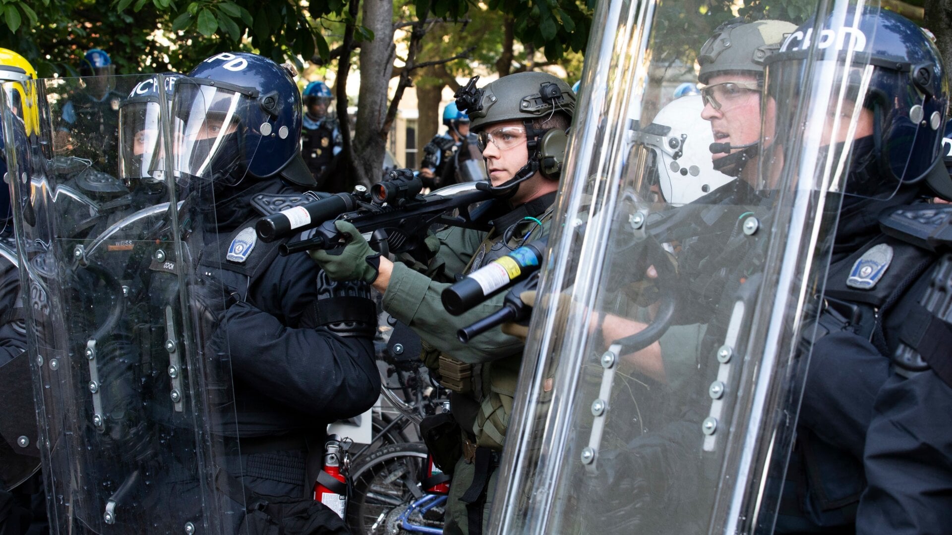 Police officers wearing riot gear shoot rubber bullets at demonstrators outside of the White House, June 1, 2020 in Washington D.C., during a protest over the police killing of George Floyd, an unarmed black man.