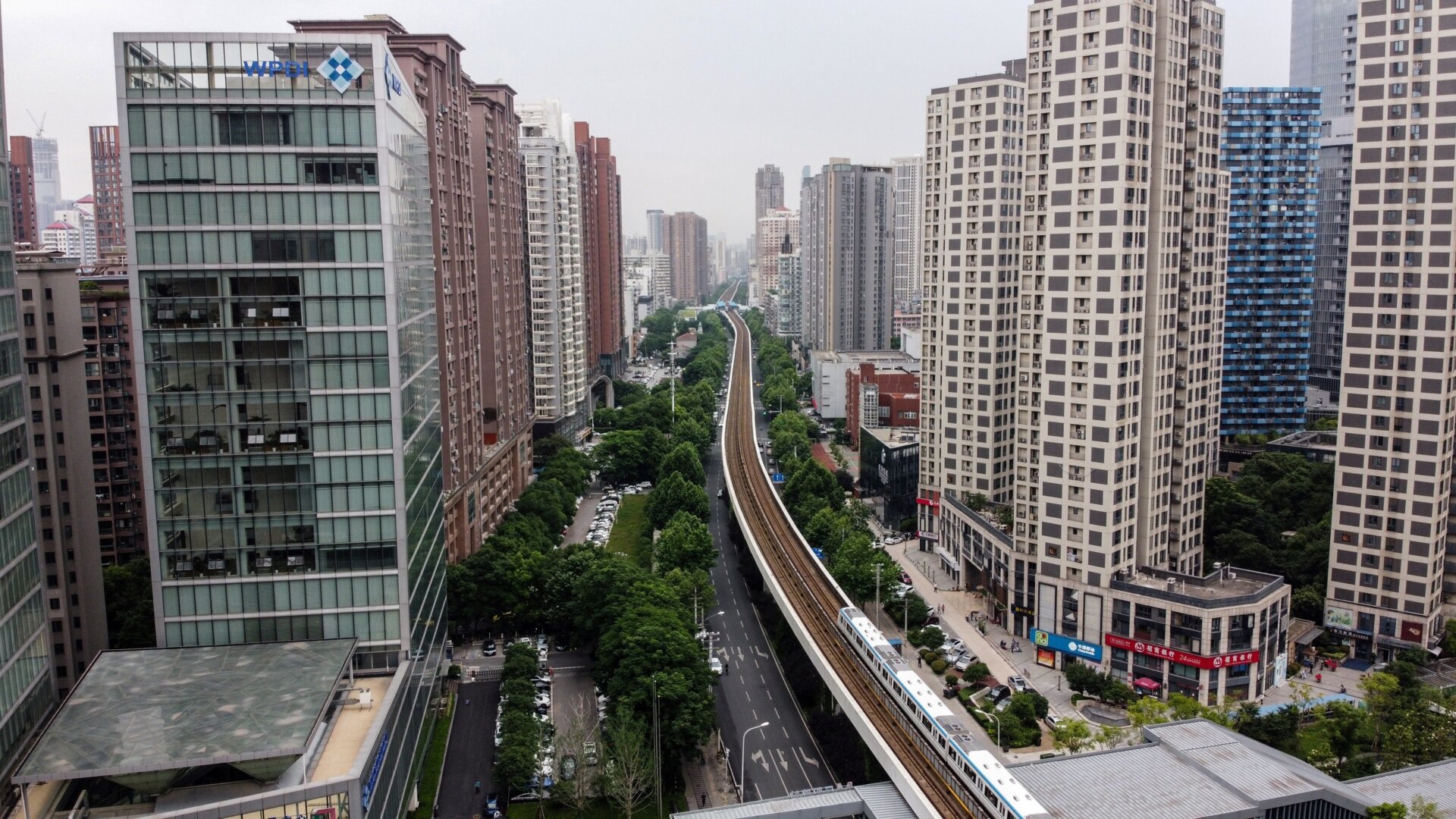 An aerial photo shows buildings and a metro train in Wuhan, China, the original epicenter of the coronavirus.
