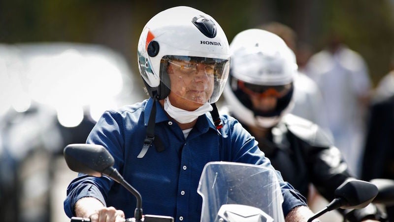 Brazilian President Jair Bolsonaro went for a motorcycle ride in Brasilia on Saturday after announcing that he had tested negative for covid-19.