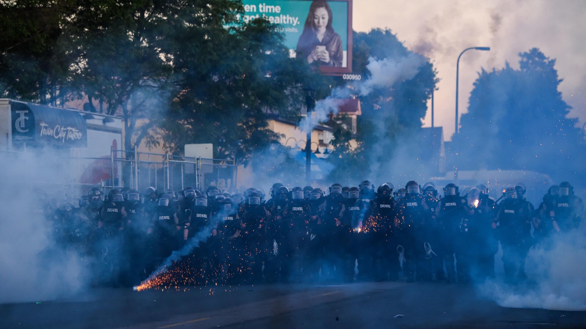Police launch tear gas and fire rubber bullets toward protesters and the media near near the 5th police precinct during a demonstration to call for justice for George Floyd on May 30 in Minneapolis, Minn.