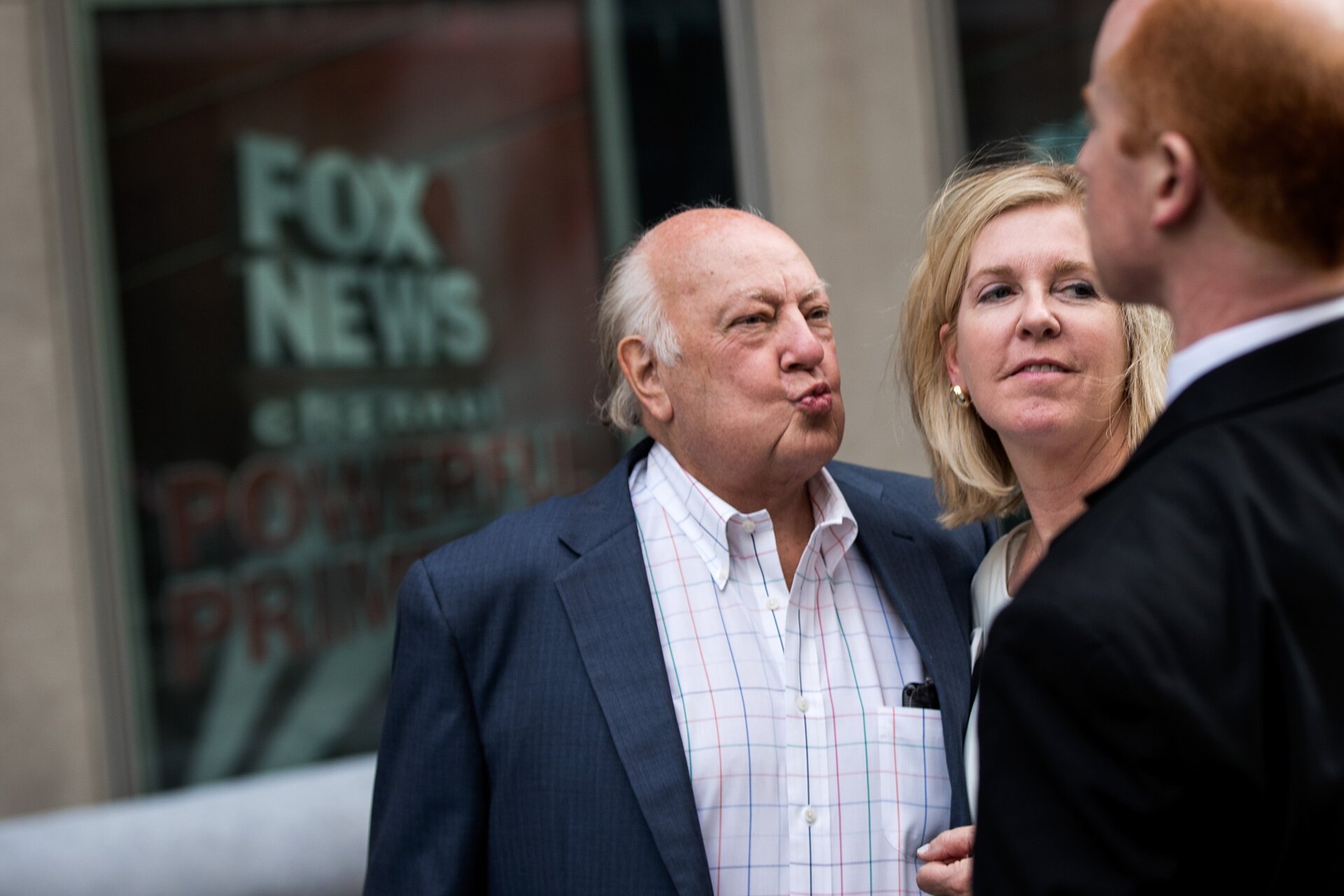 Fox News chairman Roger Ailes walks with his wife Elizabeth Tilson as they leave the News Corp building, July 19, 2016 in New York City. caption