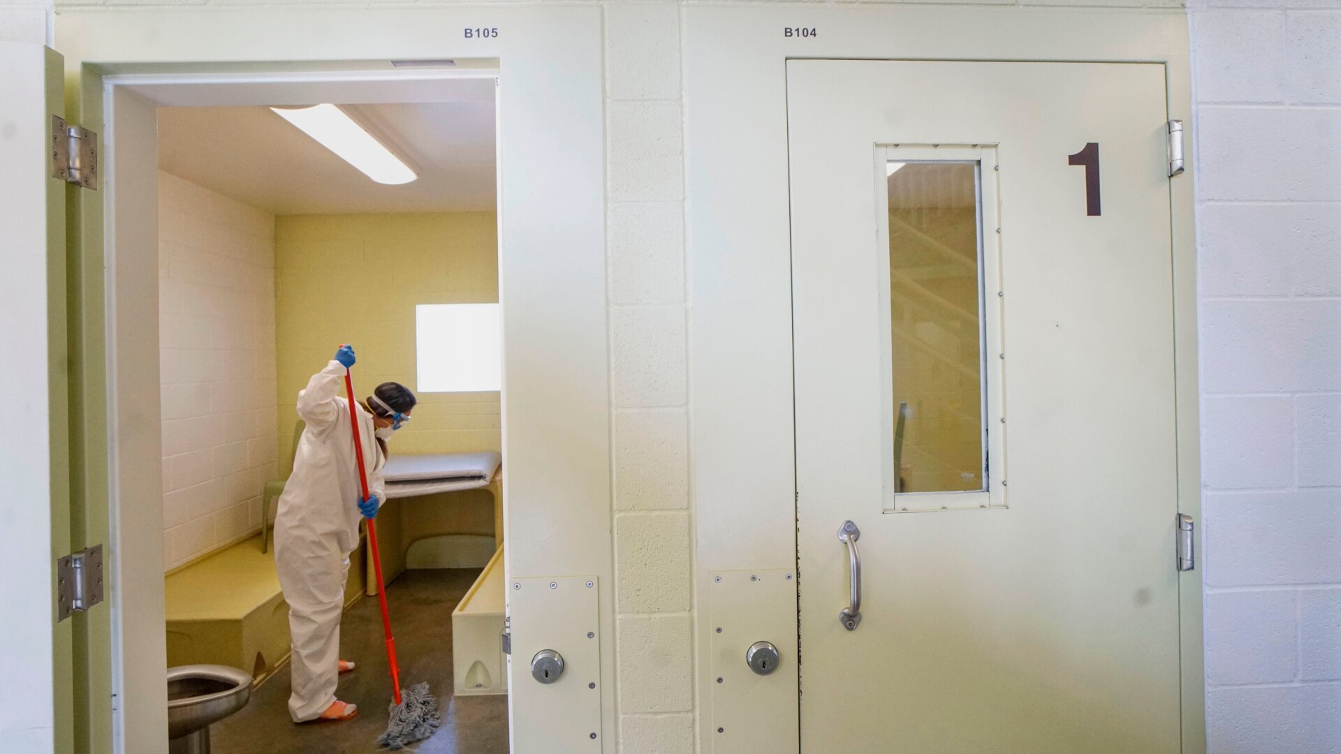 An inmate cleans a jail cell at Las Colinas Women’s Detention Facility in Santee, California, on April 22, 2020.