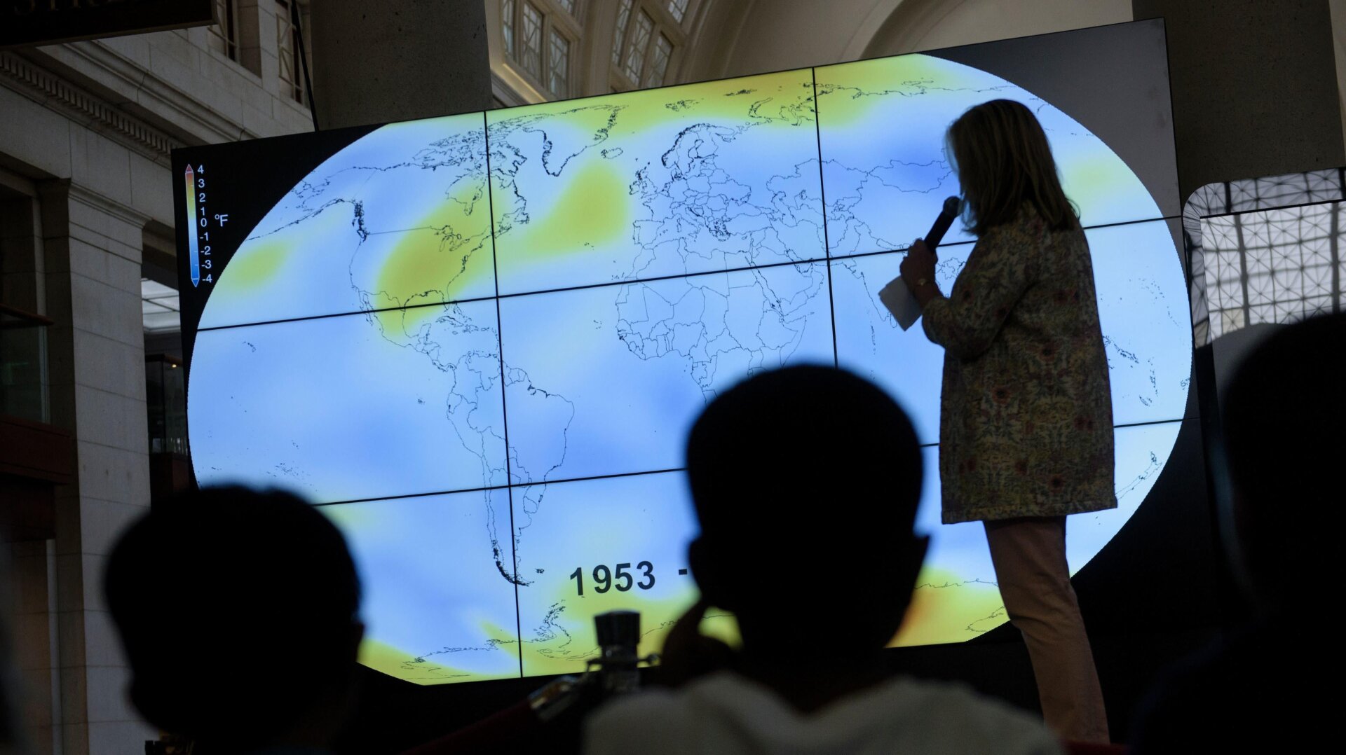 Students watch a presentation at an event sponsored by NASA to celebrate Earth Day on April 22, 2016, in Washington, DC.