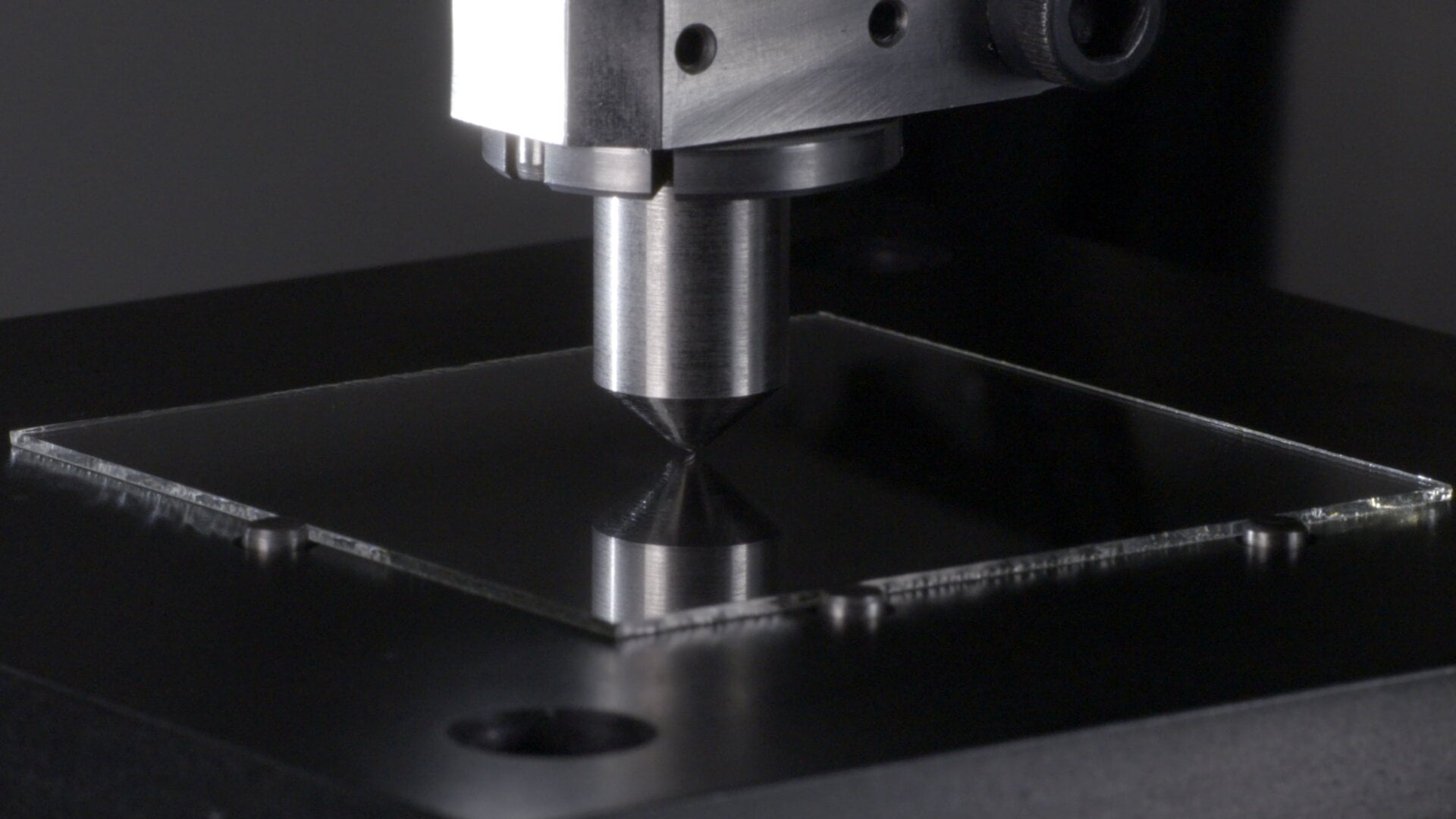 Here’s a photo from Corning showing a scratch testing being performed on Gorilla Glass Victus.