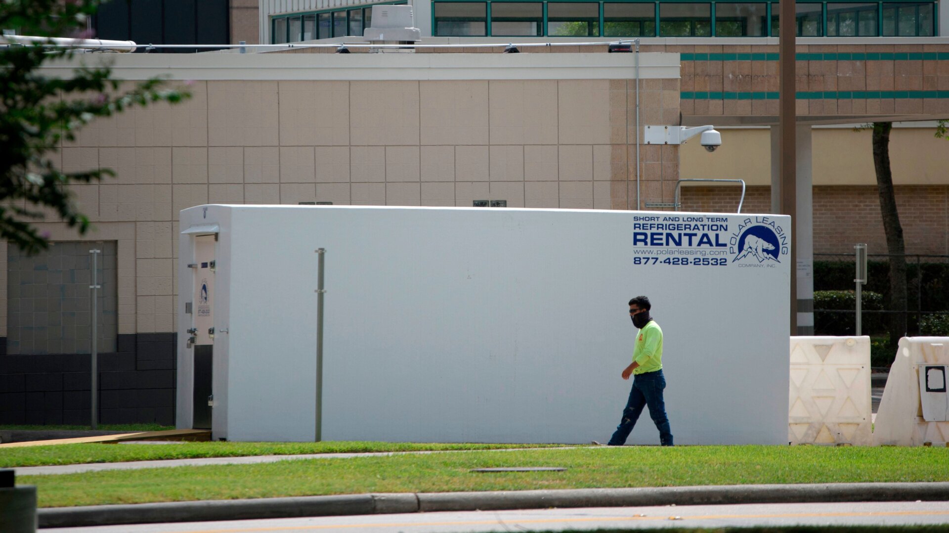 A refrigerated trailer sits outside of HCA Houston Healthcare Northwest in Texas on July 17, 2020. Hospitals in hard hit areas are once again being forced to store the dead elsewhere as their morgues fill up.