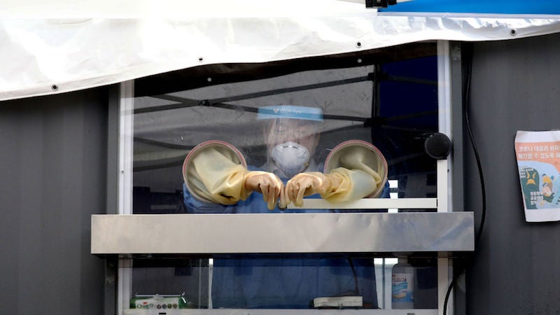 A medical worker prepares for covid-19 testing at a temporary test facility on August 26, 2020 in Seoul, South Korea.