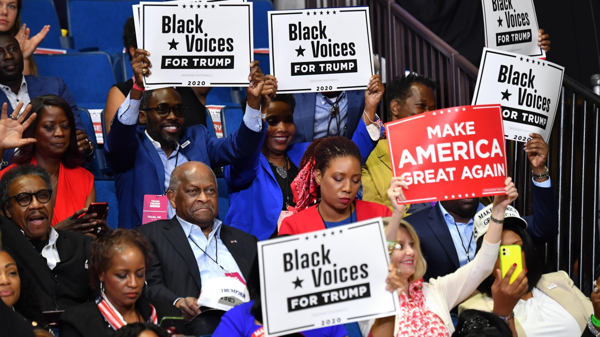 Herman Cain (center) attends a rally for President Donald Trump at the BOK Center on June 20, 2020 in Tulsa, Oklahoma.