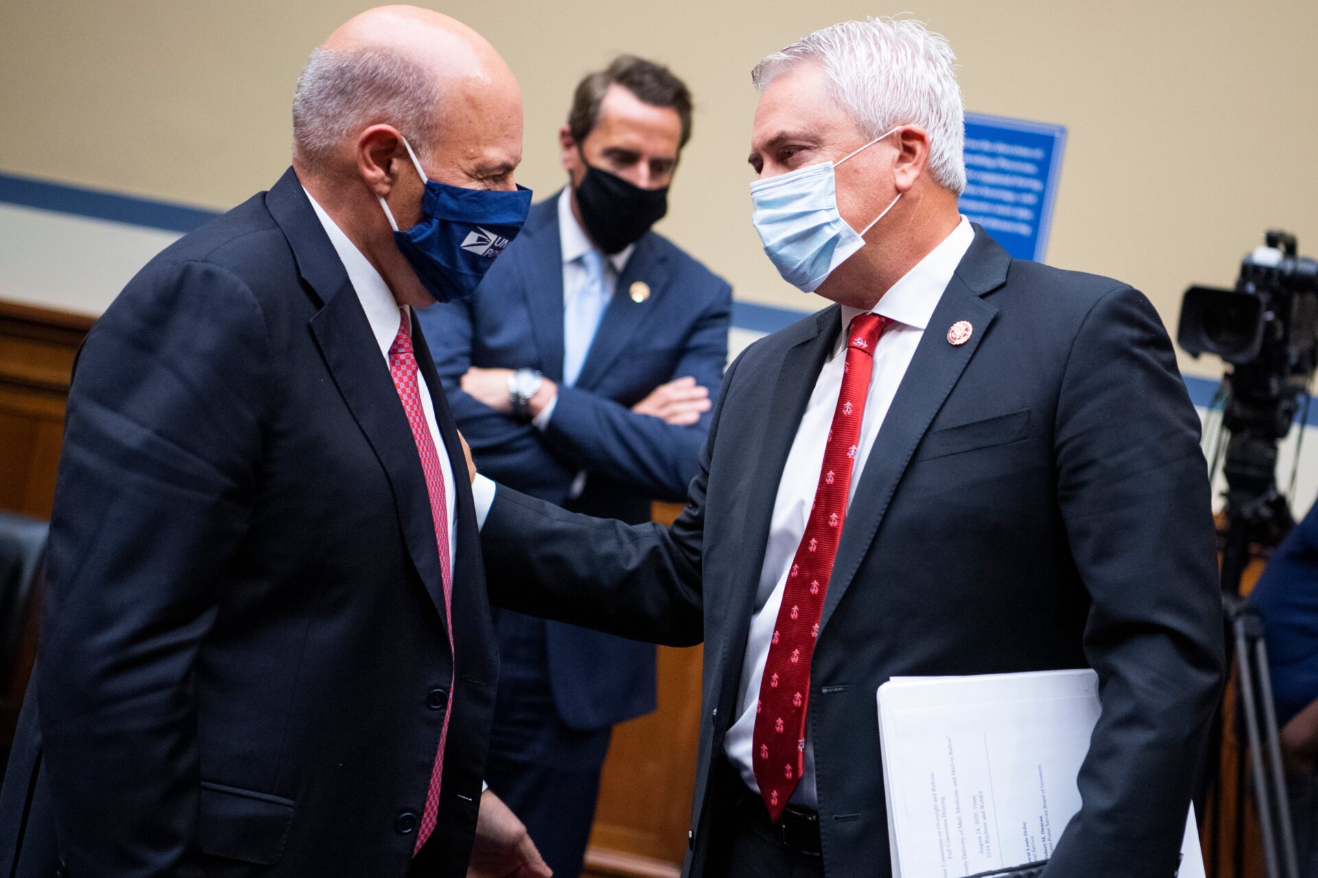 Postmaster General Louis DeJoy exchanges words with Rep. James Comer, the House Oversight Committee’s top Republican, during Monday’s hearing.