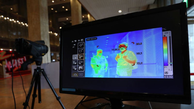 The audience walks past a thermal camera in light of the coronavirus at a Sejong Culture Center ahead of musical ‘Mozart’ on July 21, 2020 in Seoul, South Korea.