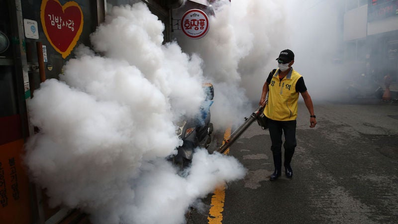 A worker disinfects an alley to prevent the spread of the coronavirus on August 29, 2020 in Seoul, South Korea.