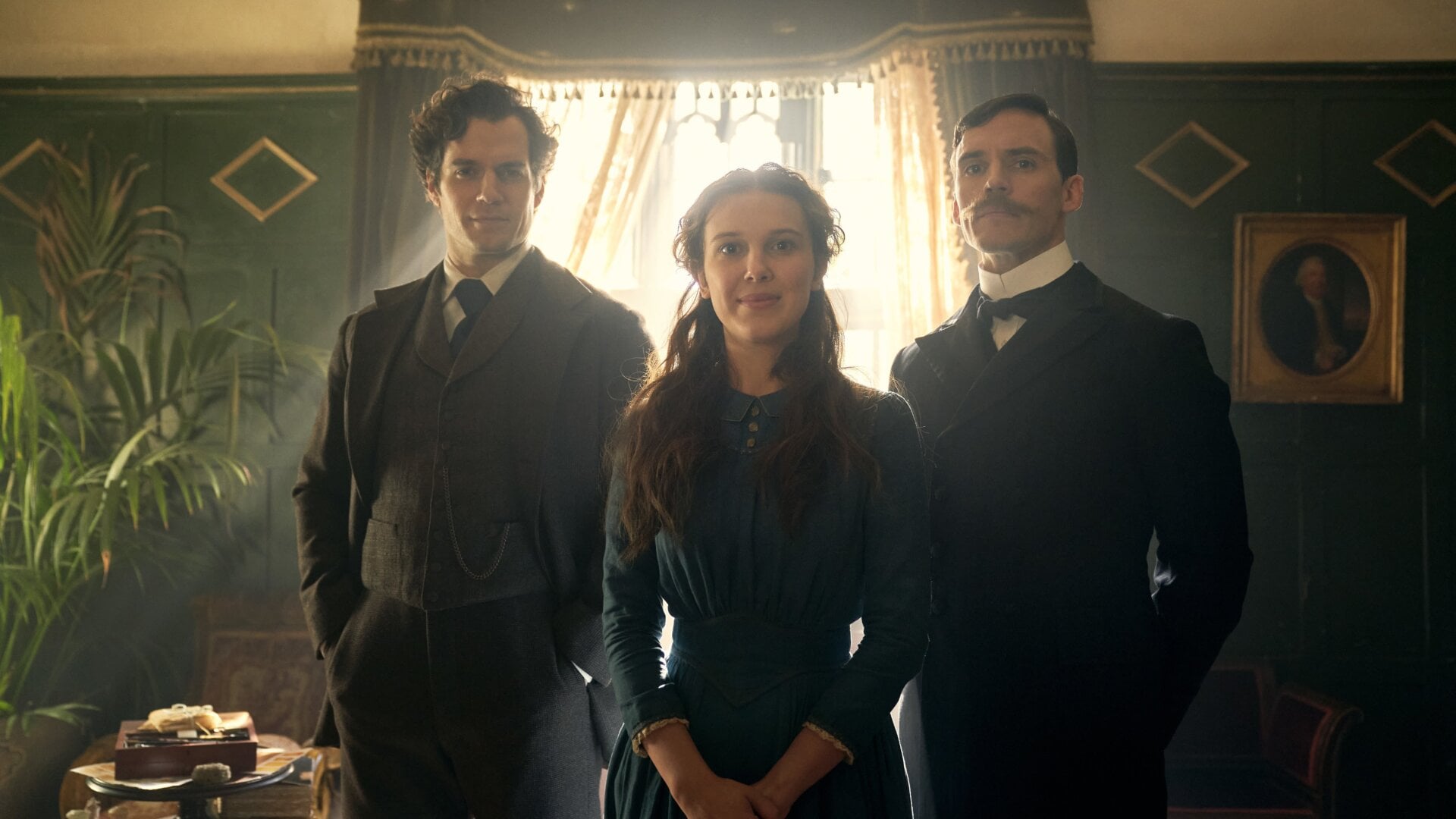 Enola Holmes (Millie Bobby Brown) poses with her detective brothers.