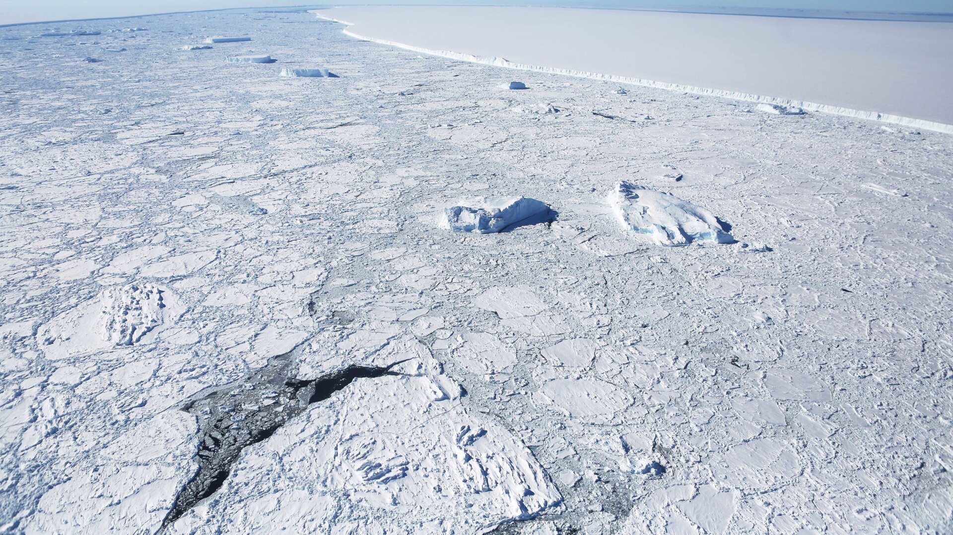The western edge of the famed iceberg A-68 (TOP R), calved from the Larsen C ice shelf, is seen from NASA’s Operation IceBridge research aircraft, near the coast of the Antarctic Peninsula region, on October 31, 2017, above Antarctica.