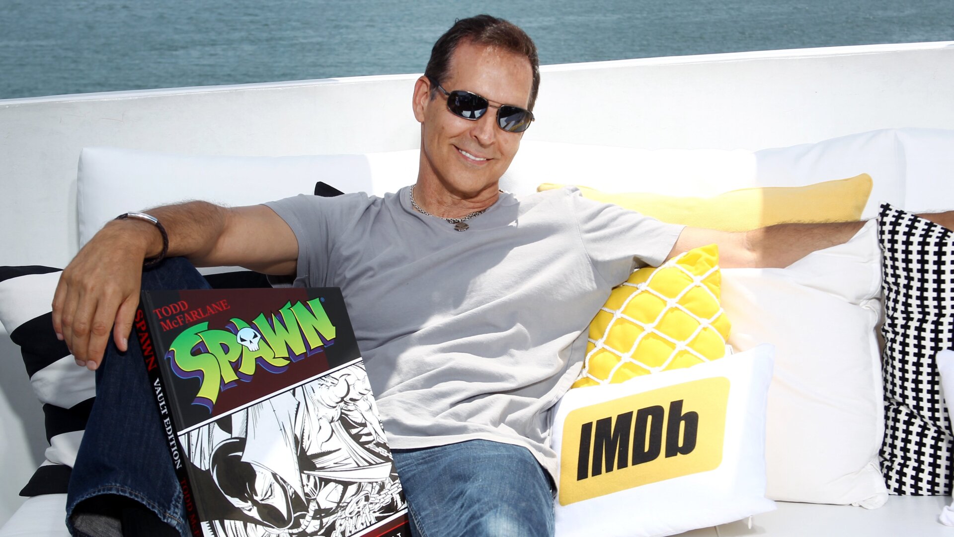 Todd McFarlane with a Spawn book.