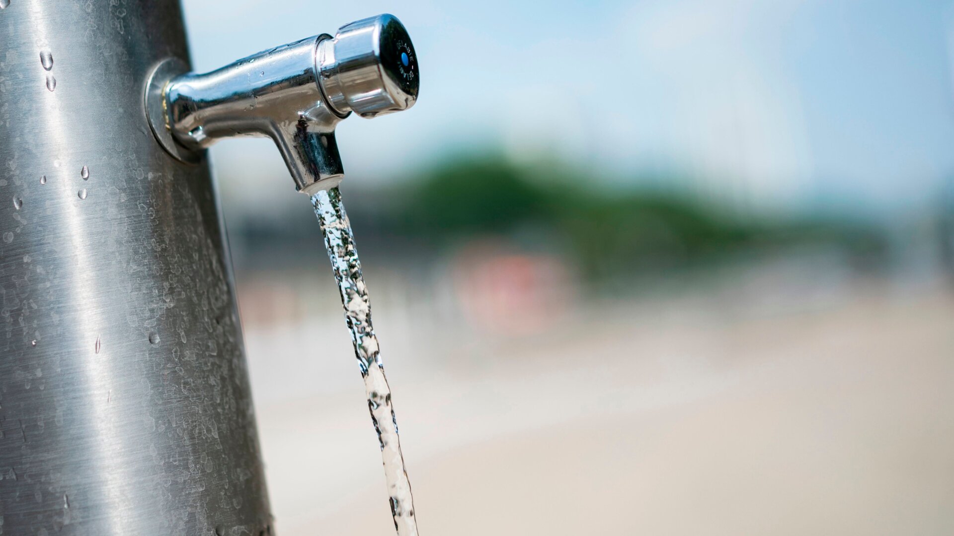 Water runs from a faucet of a water fountain at the Place de Stalingrad on June 25, 2019 in Paris.